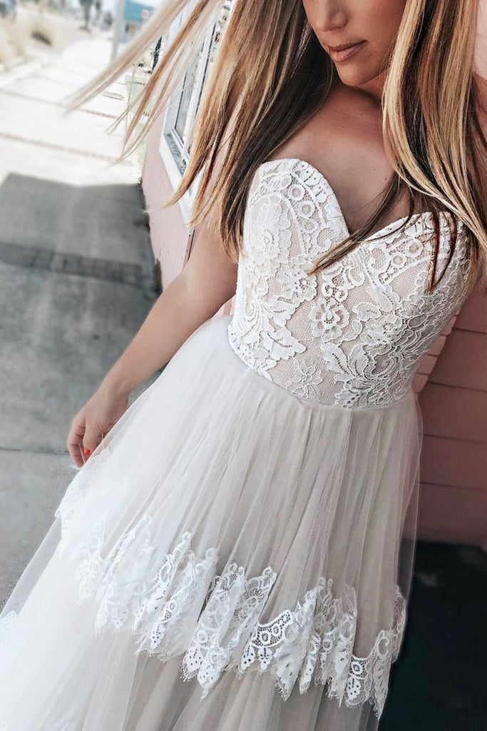 Vestido de novia de novia de marfil con gradas y apliques de encaje